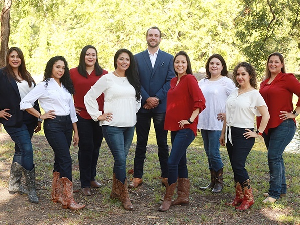 The Texas Wisdom Teeth and Dental Implants team standing outdoors
