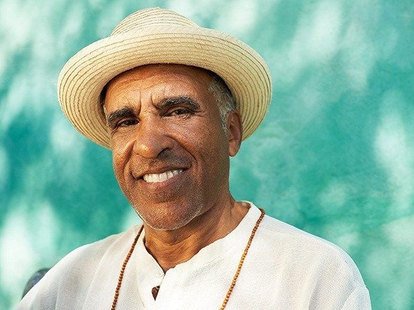Man in straw hat smiling