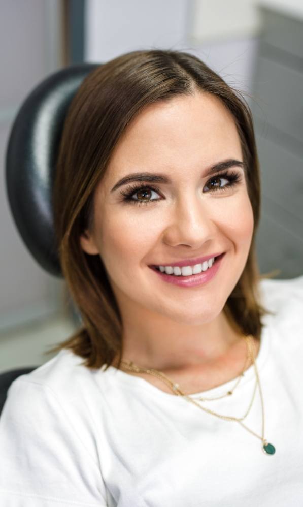Young woman smiling in treatment chair
