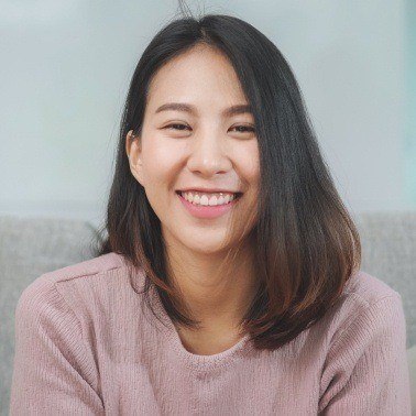Woman in pink sweater smiling