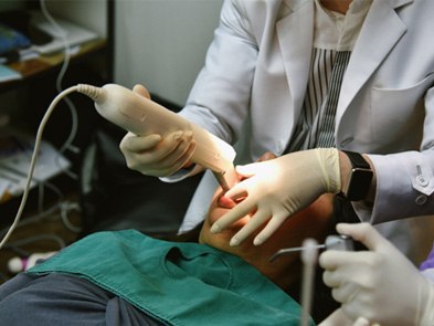 dentist using an Itero intraoral scanner device 