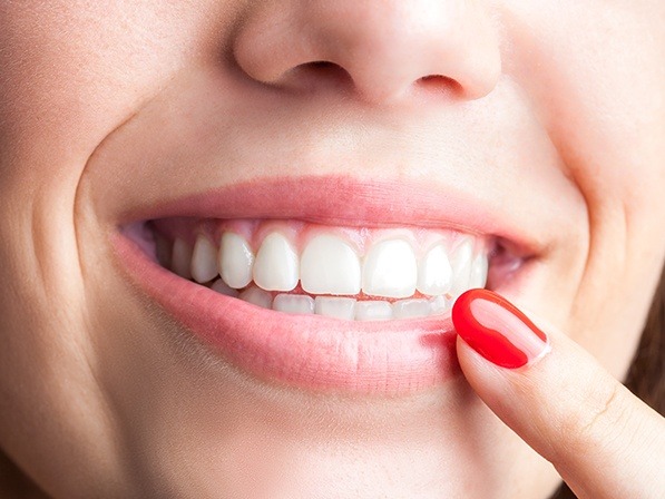 Closeup of healthy smile after visiting an oral surgeon