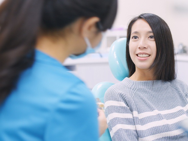 Woman discussing I V sedation dentistry with her oral surgeon