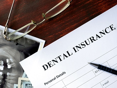 Dental insurance form on table