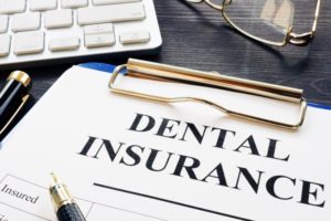 Dental insurance paperwork on clipboard in Dallas