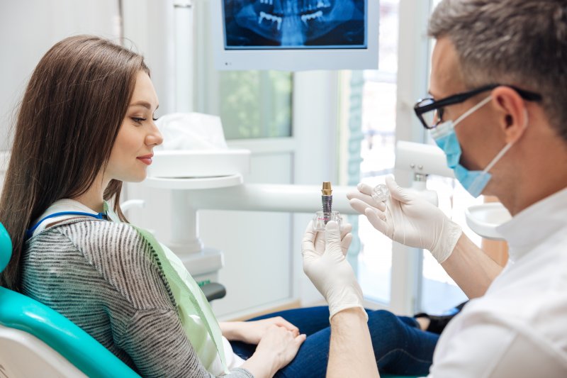A dental patient receiving a dental implant consultation